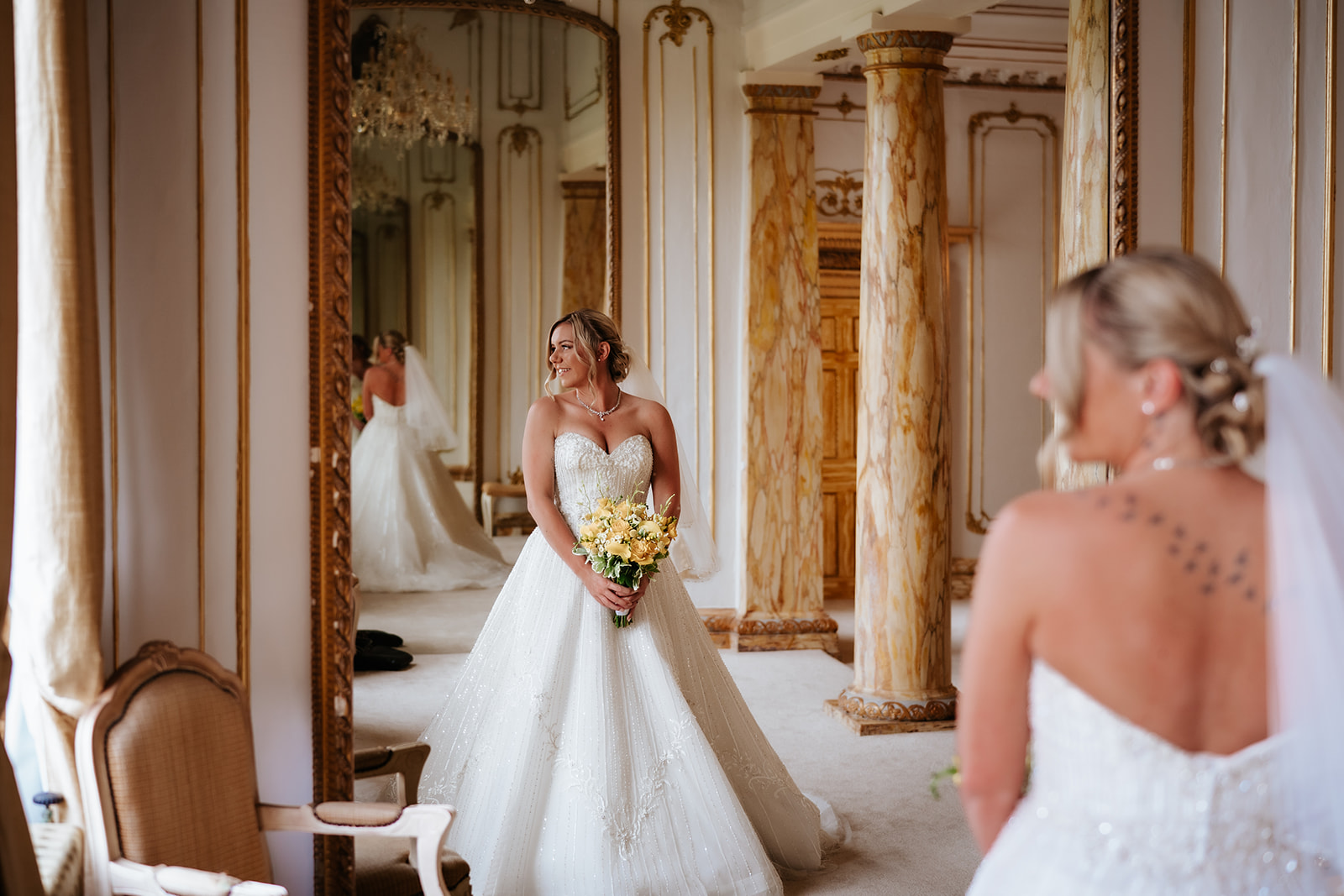 Bride and groom share a moment in the rococo bridal suite.