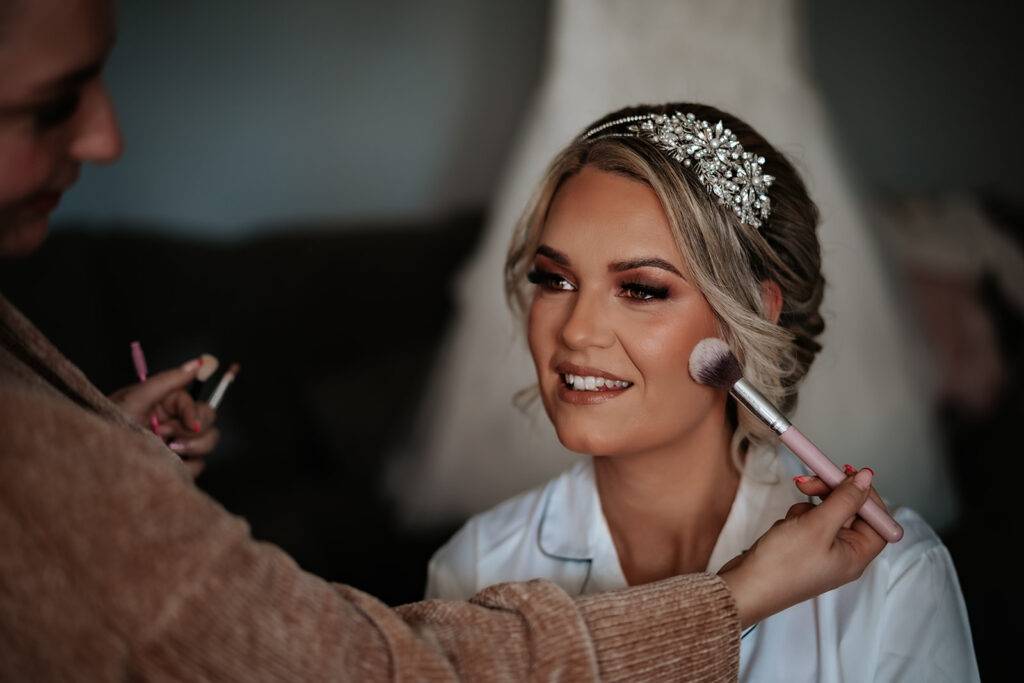 bride having her make up done for her essex wedding photography