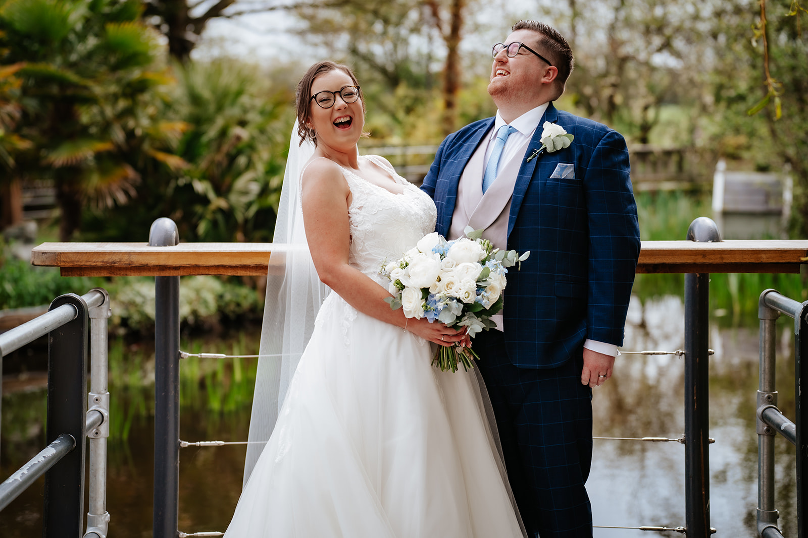Couple share a fun moment of laughs after their ceremony at the Friern Manor country hotel.
