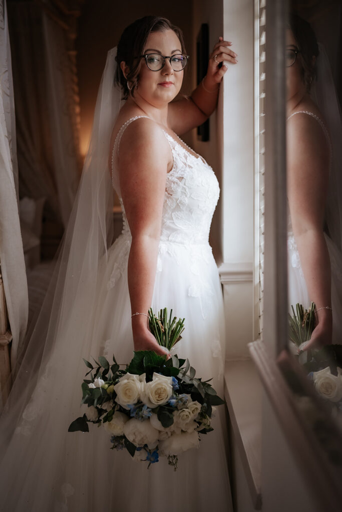 bride smiling for the camera for her essex wedding at friern manor wedding venue