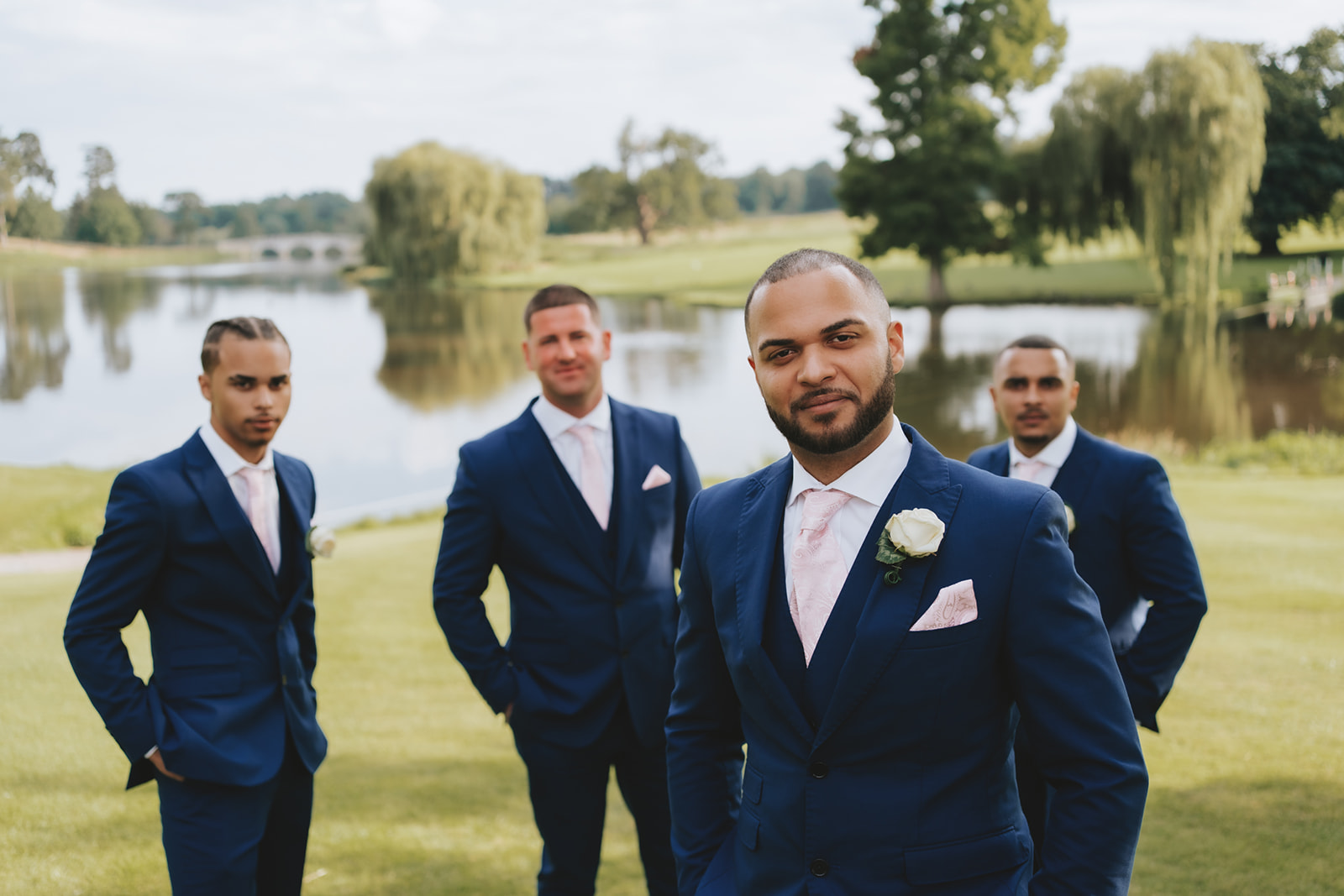 The groom and his groomsmen at the garden room at Brocket Hall wedding venue. Highlighting the importance of a second photographer. 