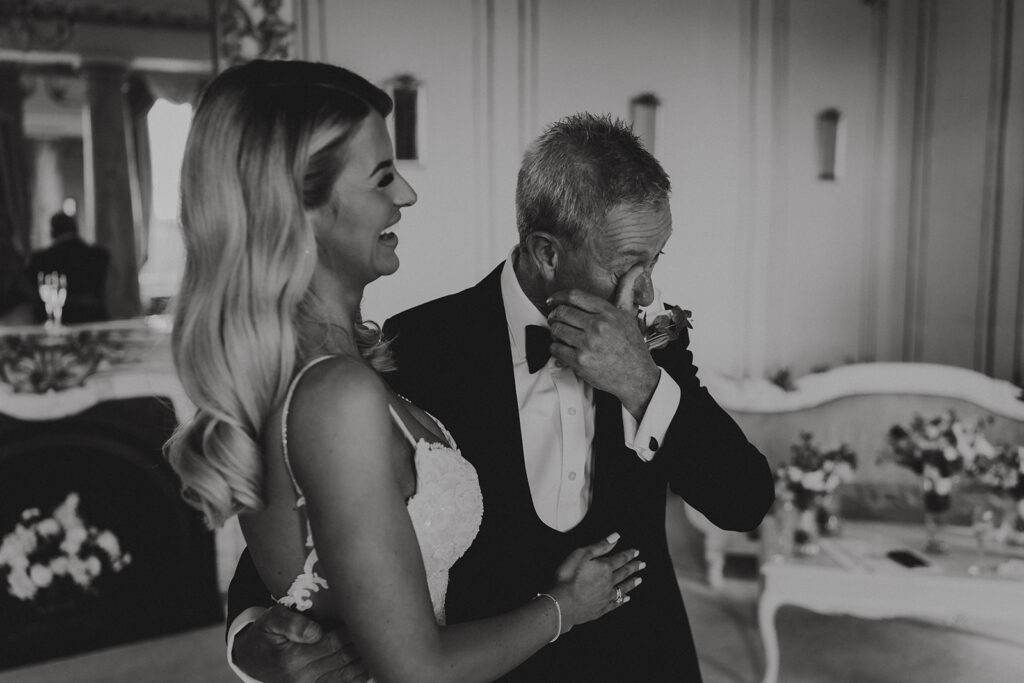 dad crying as he before he gives his daughter away for her wedding at gosfield hall wedding venue.