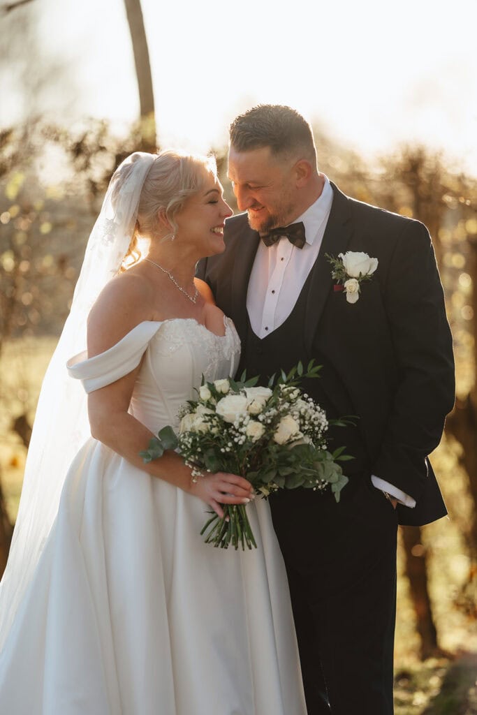 A newly married wedding couple share an intimate moment on their wedding day at Mulberry house in Essex