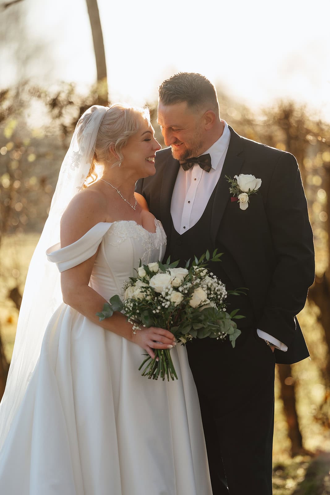 A newly married wedding couple share an intimate moment on their wedding day at Mulberry house in Essex